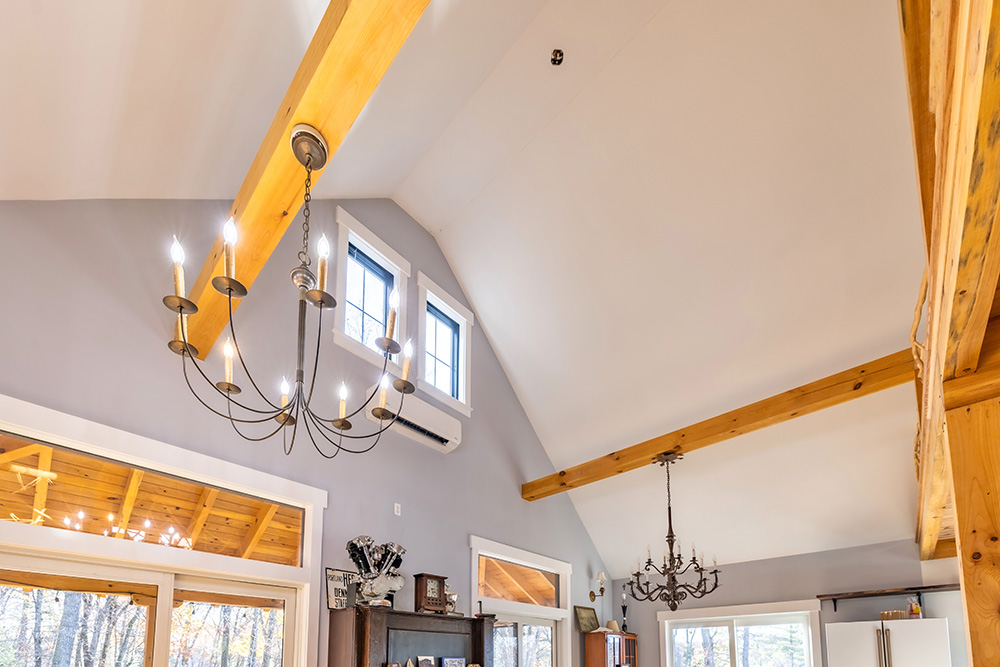 Modern light fixture on wood ceiling
