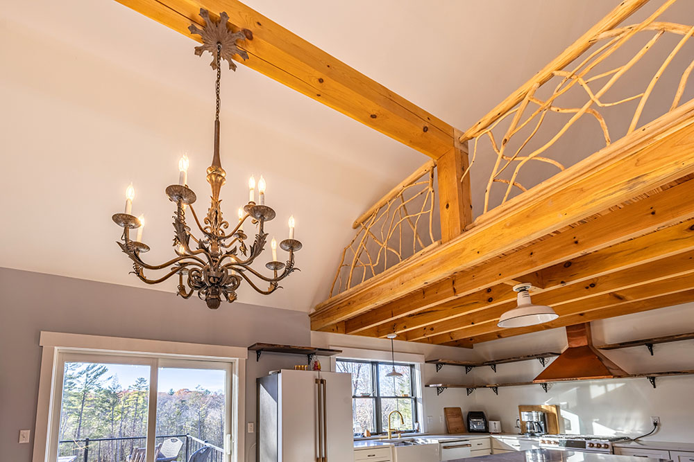 Modern light fixture on wood ceiling