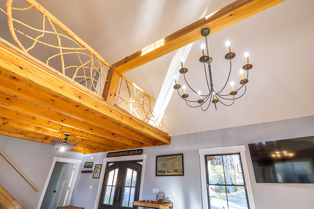 Modern light fixture on wood ceiling
