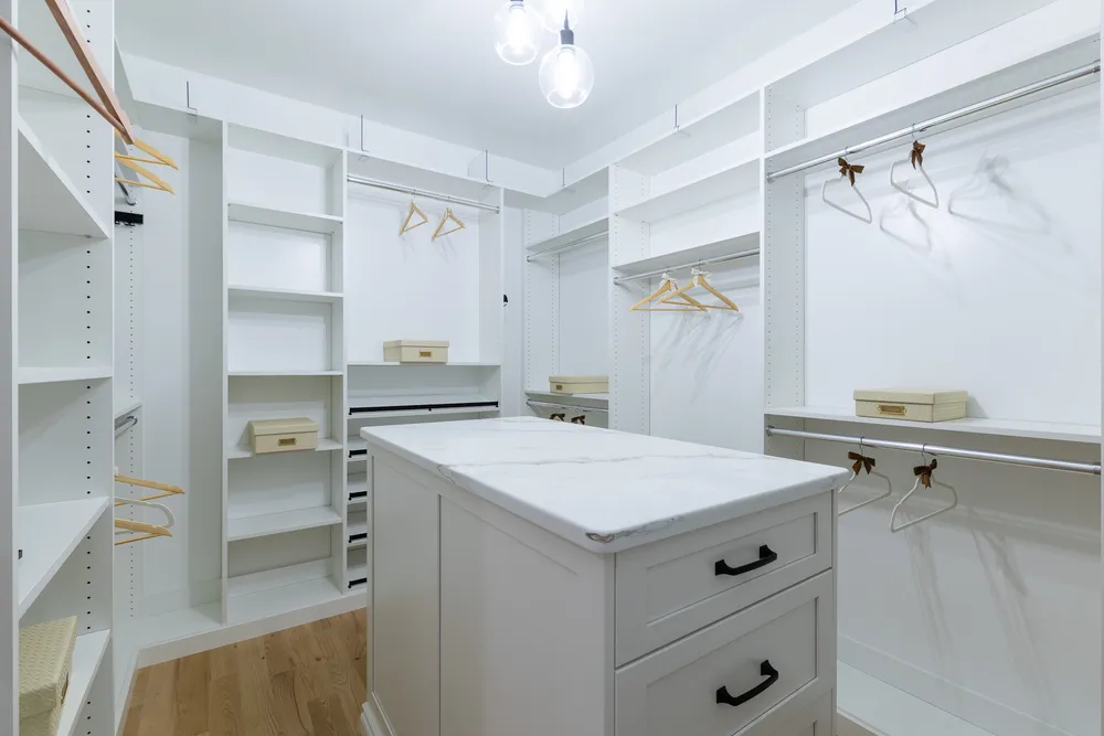 5 Steven Circle, Farmington. Custom primary walk-in closet w. wood cabinet center Island w. Full length lit mirror