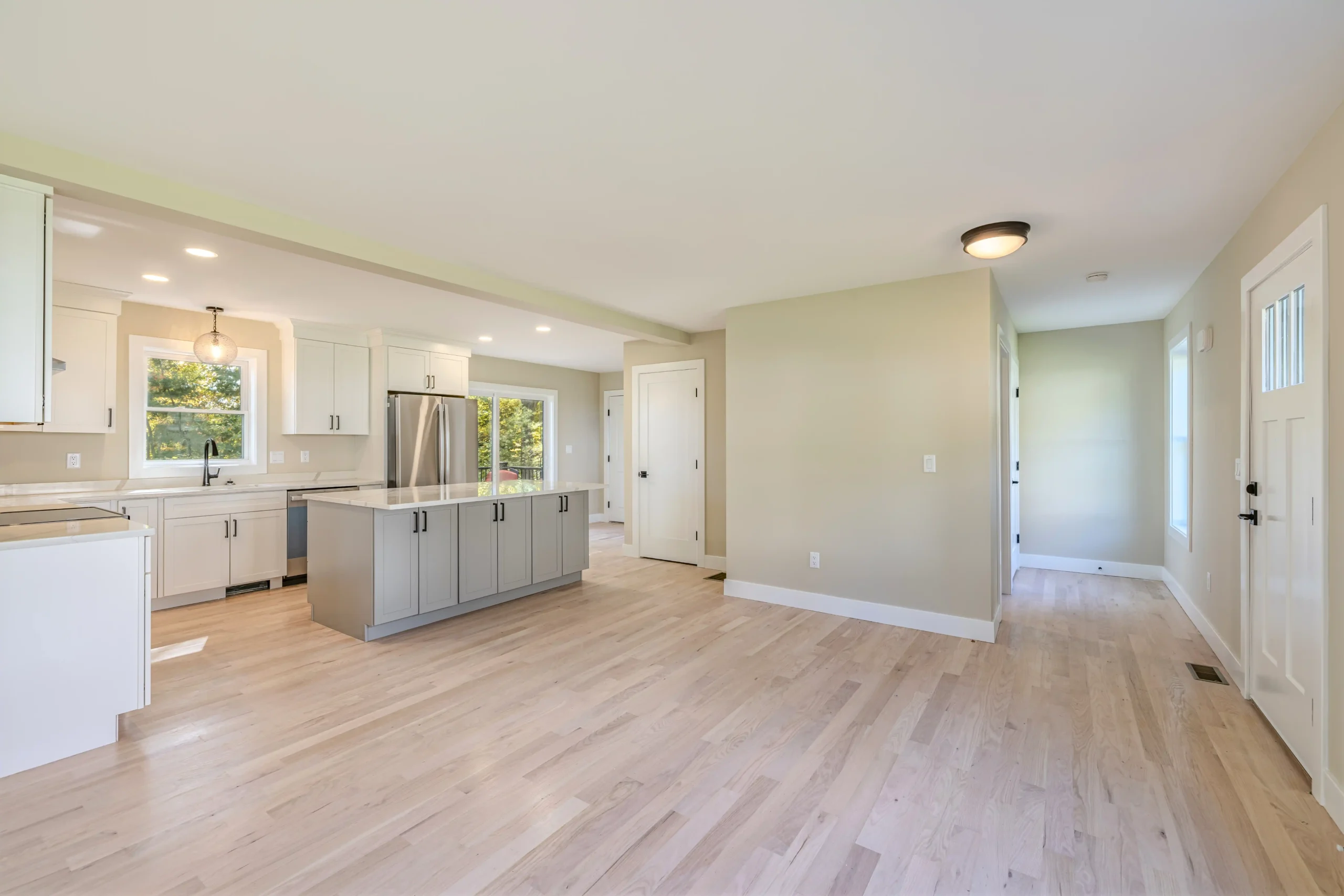 Crystal Lake Home 5 Elm Street - Spacious open-concept kitchen and living area with central island and recessed lighting