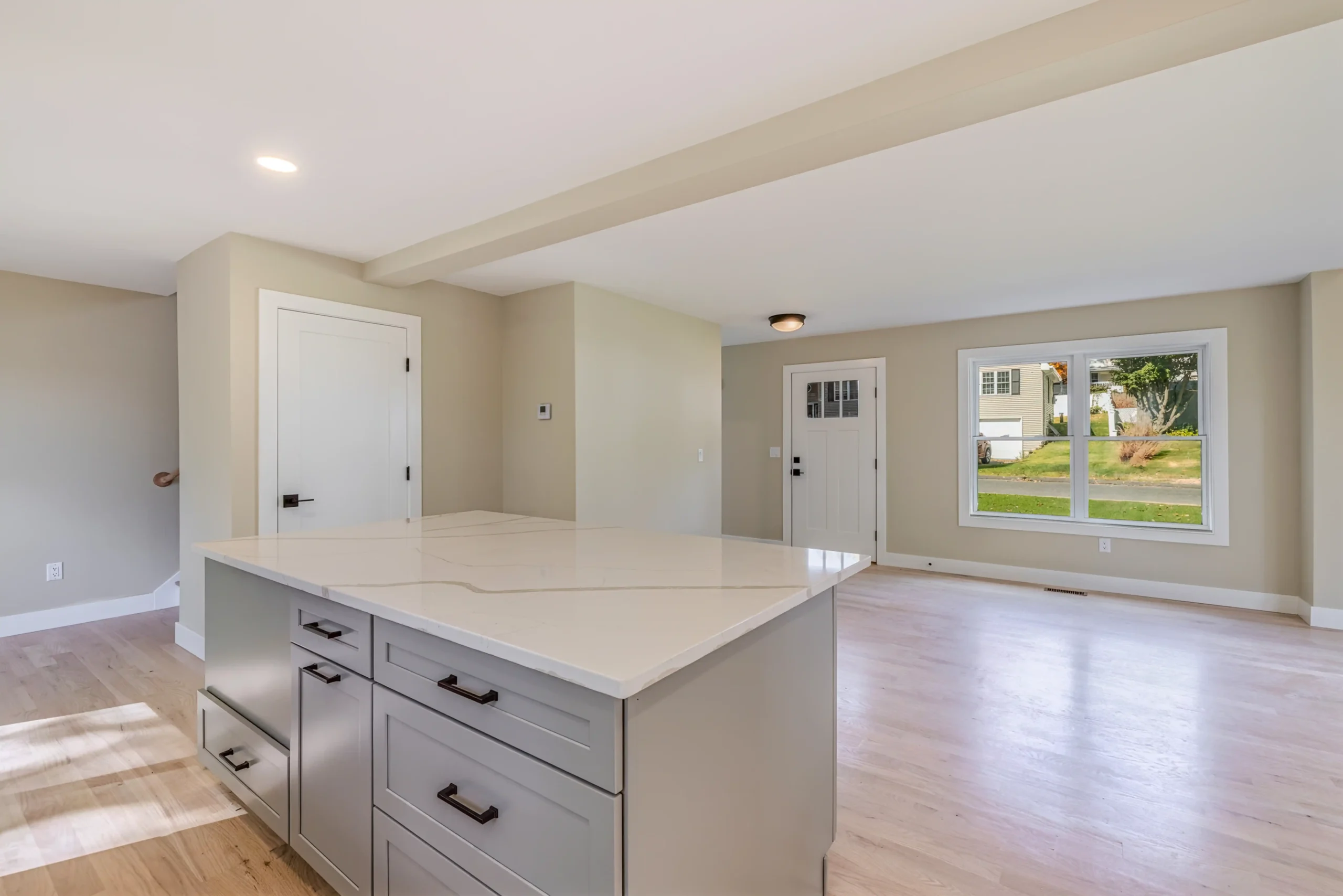 Crystal Lake Home 5 Elm Street Open living area with recessed lighting, neutral walls and large windows