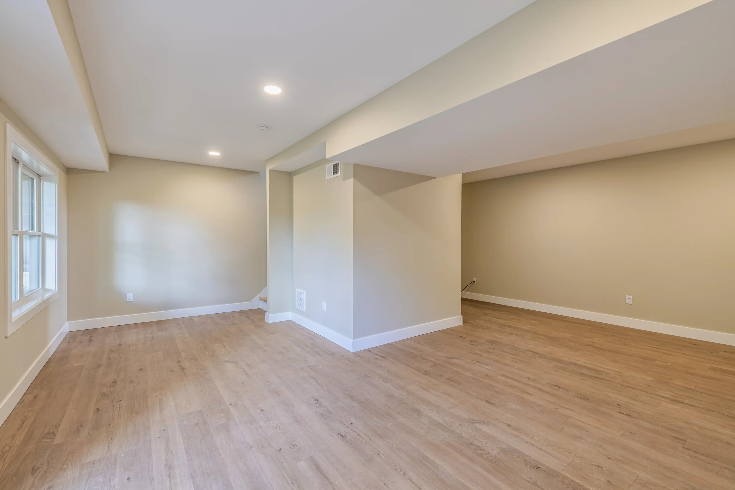 Crystal Lake Home 5 Elm Street Spacious finished lower-level recreation room with neutral walls and recessed ceiling lights