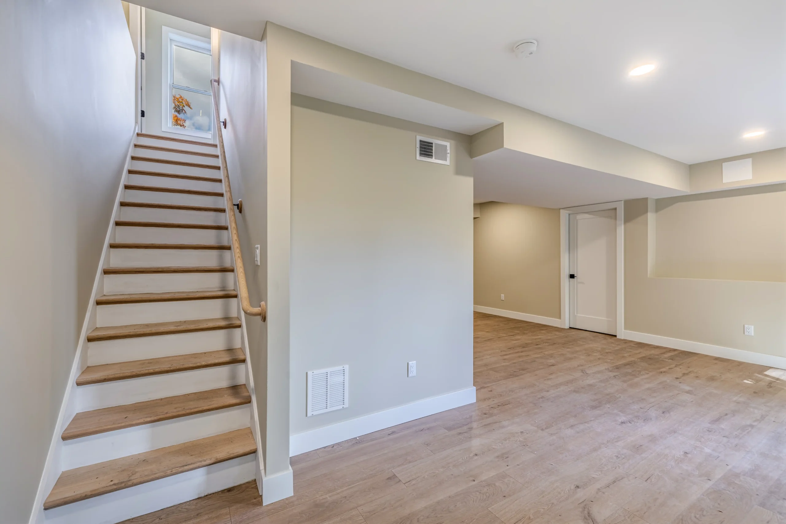 Crystal Lake Home 5 Elm Street Interior staircase leading to a finished lower level with recessed lighting