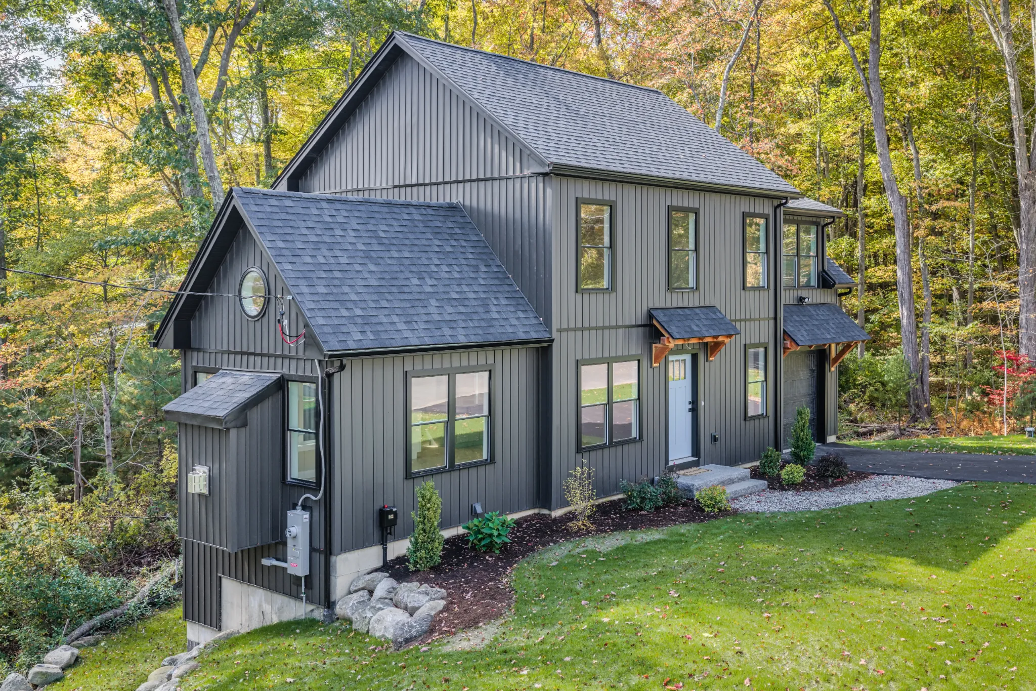 Crystal Lake Home 5 Elm Street Exterior view of dark gray Crystal Lake home featuring multiple gabled rooflines